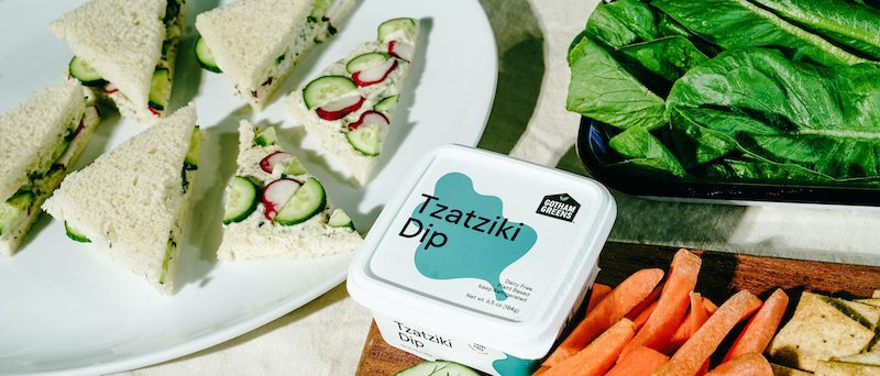 gotham greens tzatziki dip sits next to tea sandwiches