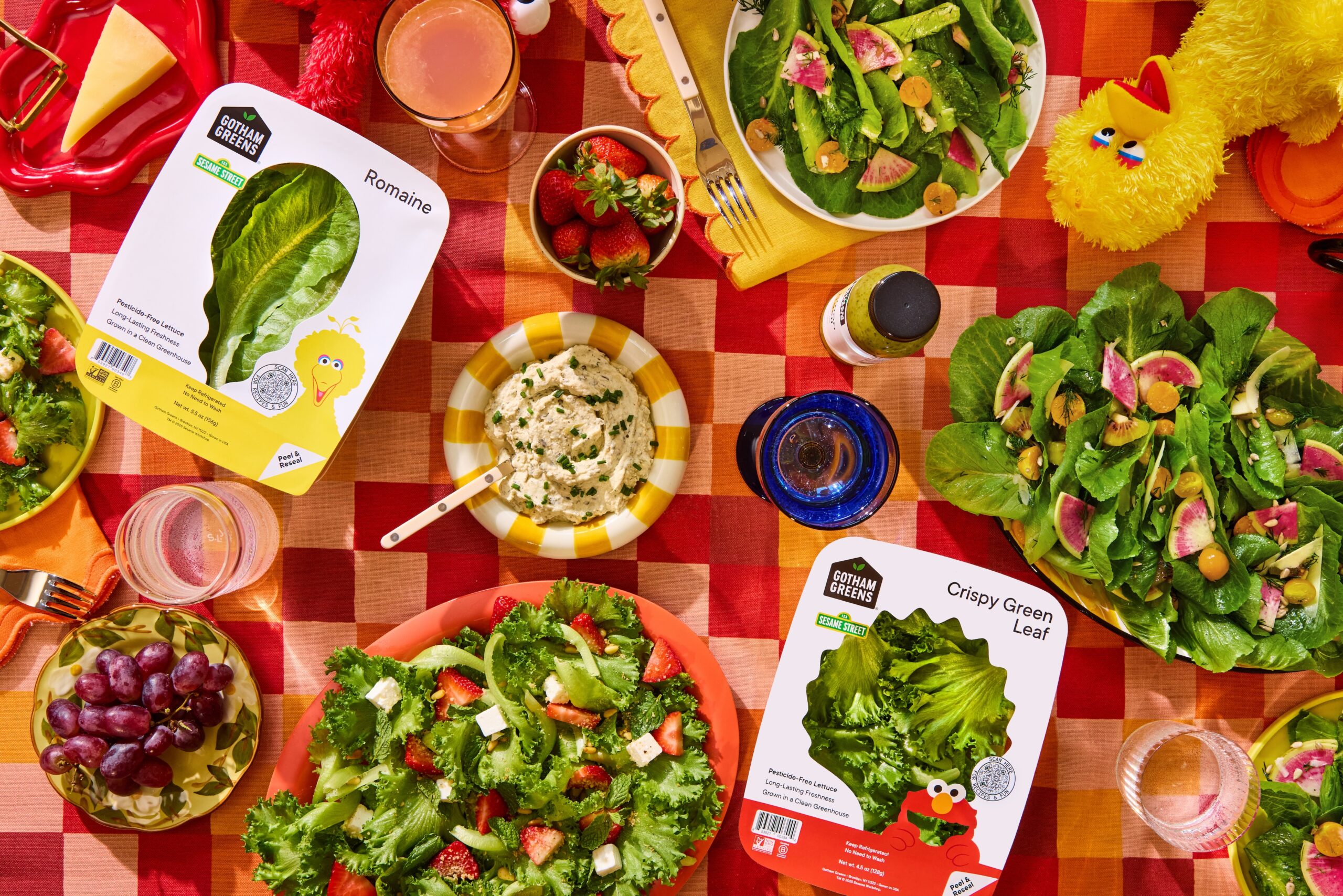 Gotham Greens + Sesame Street collaboration: Big Bird appears on Romaine lettuce, Elmo appears on Cripsy Green Leaf lettuce package